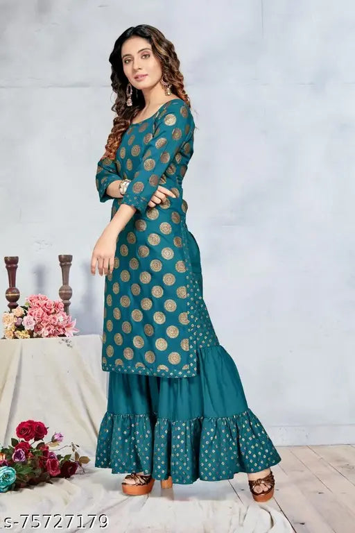 Foil print rayon kurta with sharara bottom, round neck and three-quarter sleeves. Indian women's fashion for party wear and wedding events