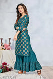 Foil print rayon kurta with sharara bottom, round neck and three-quarter sleeves. Indian women's fashion for party wear and wedding events