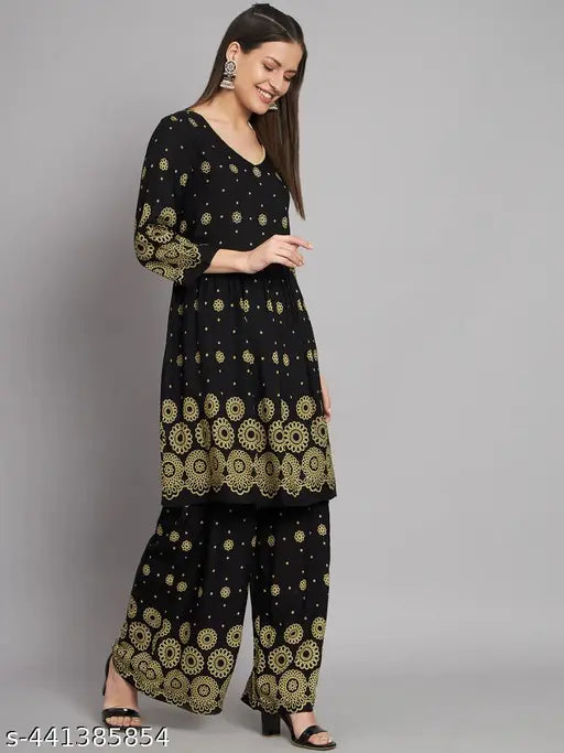 Floral printed pleated A-line kurta with rayon palazzos, intricate Adda handwork and Kantha work embellishments