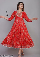 Designer Bandhani Rayon Kurta with heavy embroidery, three-quarter sleeves, vibrant dyed/washed pattern. Indian ethnic wear for women on mannequin