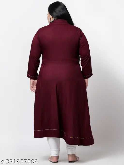 Maroon plus size rayon straight V-neck kurti, three-quarter sleeves, solid design. Women's Indian fashion on mannequin