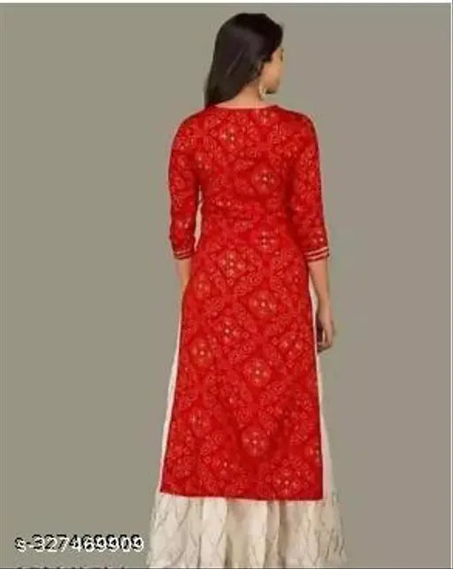 Red and white traditional women's kurta set with sharara
