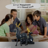 Black resin deer statues, handcrafted pair for home & office decor. Detailed animal figurines, perfect for gift or display. Vastu/Feng Shui symbol for happy relationships. Made in India