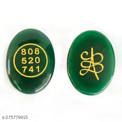 Green Jade Zibu Symbols Coin, attracts wealth, luck, prosperity. Oval shape Feng Shui gemstone on display