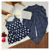 Blue kids' cotton kurti, dhoti, dupatta set - contemporary style with ruffle detail, color-block print, and elasticated waist. Perfect for summer outfits, parties, beachwear, or casual wear. Designed by Indian brand Nivudi
