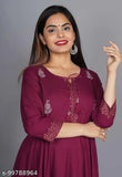 Purple rayon flared kurti with tussles, three-quarter sleeves, solid pattern. M: bust size 38in, L: bust size 40in, XL: bust size 42in, XXL: bust size 44in, Indian ethnic wear