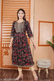 Black gold rayon kurti with three-quarter sleeves, printed combo on model