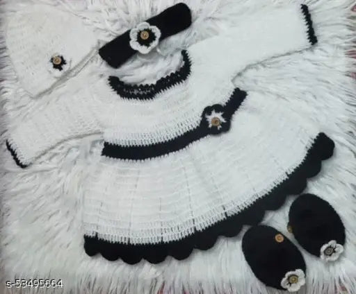 Handmade acrylic woolen baby girl sweater with cap hairband, booties, and floral motifs. One-of-a-kind, classic style, perfect for 6-12 months