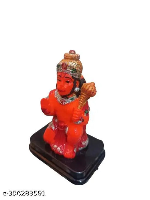 Orange polyresin Hanuman ji statue for car dashboard, symbolizing strength and prosperity