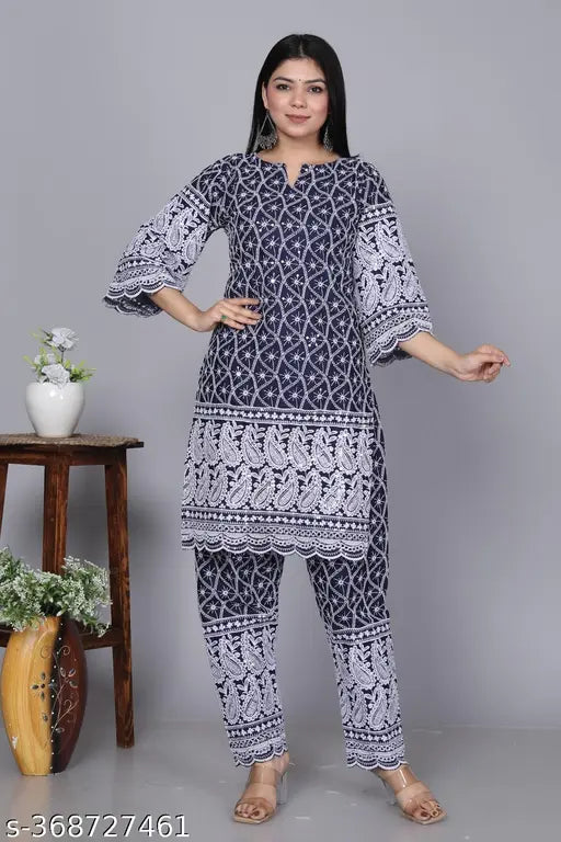 Designer DM Chikankari set, cotton blend kurta & pants with printed net pattern, three-quarter sleeves. Breathable and comfortable Indian clothing featuring intricate hand embroidery inspired by nature