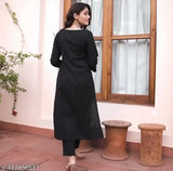 Solid black cotton kurti palazzo with rayon sleeves, perfect for traditional wear in India. Lightweight and breathable, features intricate embroidery and elastic waistband on pants