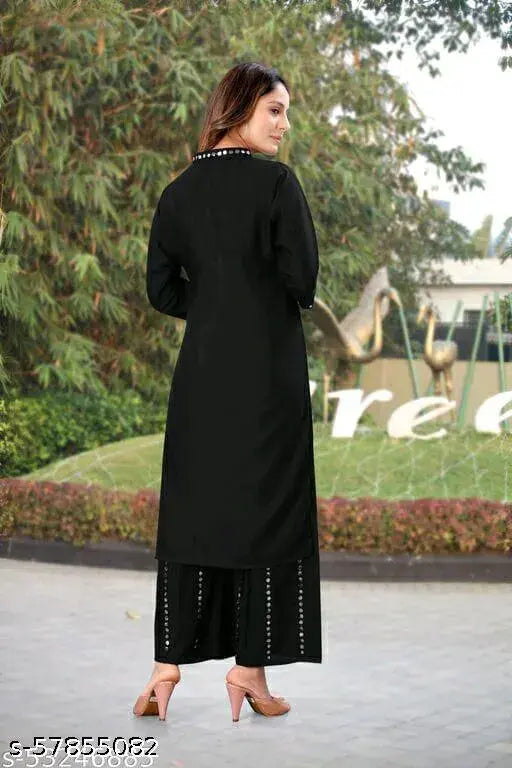Rayon ethnic festival wear kurta with palazzo, solid net, three-quarter sleeves. Indian mirror work on classic sharara style." (123 characters)