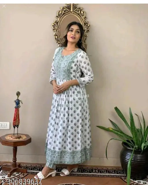 Green rayon Tana Bana Nyra cut kurta pant set, printed net design, three-quarter sleeves, beautiful Indian dress for women in sizes S, M, L, XL, and XXL