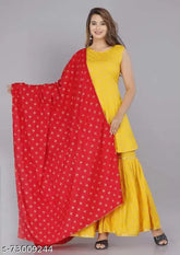 Mustered gold printed rayon kurta set with sharara and dupatta, Indian traditional clothing on display