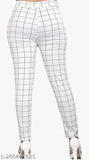 White and brown Lycra checked jeggings combo for women with advanced double pockets, providing comfort and a body-fit. Two sizes shown: 26" waist and 30" waist. Made in India