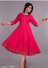 Pink rayon flared yoke-embroidered Kurti with three-quarter sleeves, solid print design. Sizes: S (36 in bust), M (38 in bust), L (40 in bust), XL (42 in bust), XXL (44 in bust). Traditional Indian women's fashion accessory