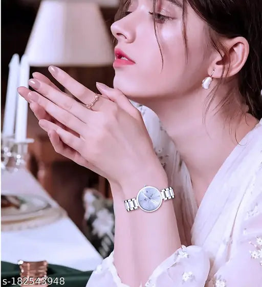 Silver stainless steel classical trandy watch with orange dial and round shape, suitable for girls and women, water-resistant up to 30 meters, quartz movement