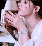 Silver stainless steel classical trandy watch with orange dial and round shape, suitable for girls and women, water-resistant up to 30 meters, quartz movement