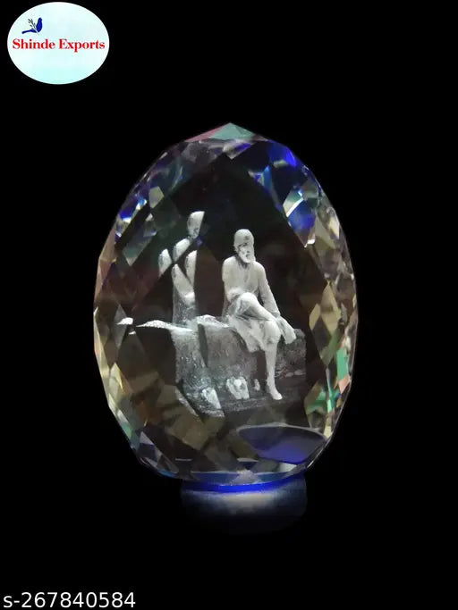 Blue crystal Saibaba idol for car dashboards, 3D engraved image of Lord Saibaba, approximately 2.5 inches tall and weighs around 300gms, perfect auto showpiece