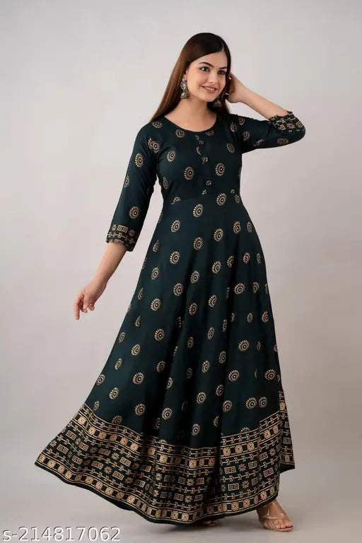 Dark green rayon Anarkali kurti with gold print for office/party wear, featuring 3/4 sleeves and round neck, available in sizes S to 4XL (36in - 48in bust)