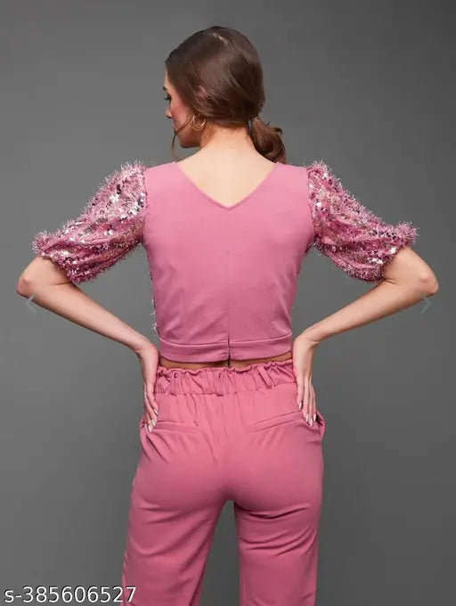 Pink and gold-toned embellished crop top with puff sleeves, and matching lycra pants by Wazix on a fashion mannequin (India)
