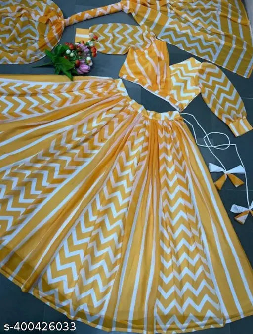 Fancy yellow chiffon Lehenga-choli set for girls, featuring detailed organza floral designs, perfect for celebrations or weddings. Includes matching crop top and skirt with elastic waist and hemlines. Indian origin