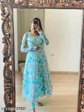 Georgette, long-sleeved Urbane Glamorous dress in elegant sky blue with floral print, featuring included gown and dupatta. Made in India." (123 characters)