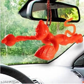 Orange plastic Hanuman idol hanging car decoration from India, perfect for personal devotion or vehicle accessories
