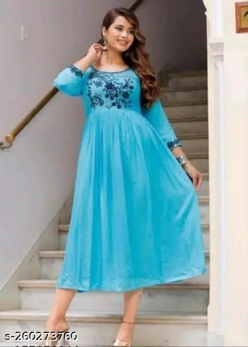 Mint green rayon Calour Malti, embroidered three-quarter sleeve blouse on hanger