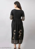 Black printed rayon flared kurta with three-quarter sleeves and round neck, ideal for casual or formal wear. Hand block pattern adds unique charm. Made in India