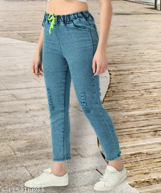 High-waisted stretchable premium denim blue jogger jeans with knee slits, suitable for a variety of fits including boyfriend, baggy, cargo, flared, and mom fit. Indian manufacturer. Ideal for women or girls