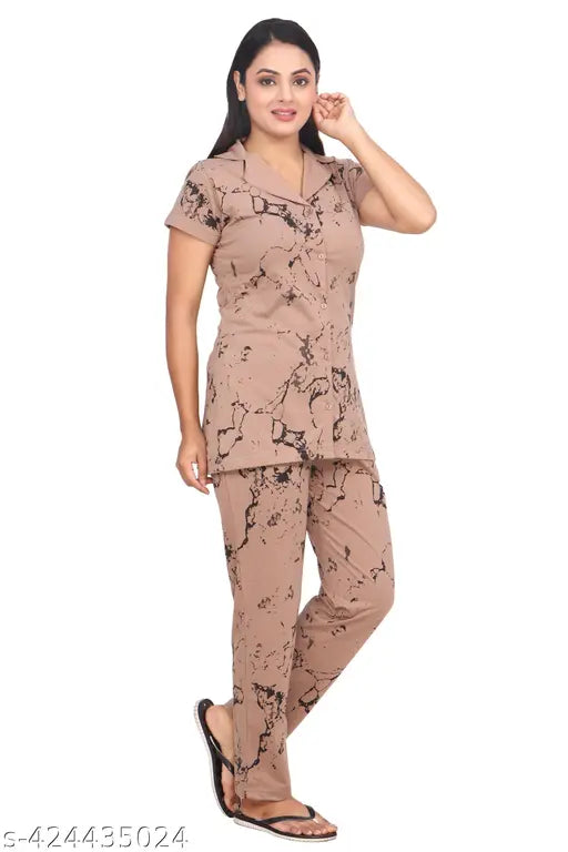Cotton blend printed summer nightsuit with collared neck half sleeve, perfect for women's sleep and relaxation in casual style. Made of polycotton fabric in India