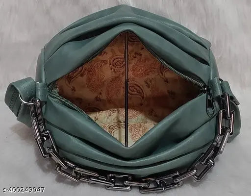 Green canvas and leather sling bag for women and girls, self-design pattern, features two compartments, free size (10x3x6 inches), made in India