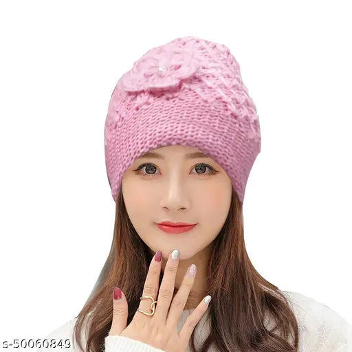 Pink woolen fur beanie with floral embroidery, unisex design for women's winter. Hand-knitted feel, machine washable