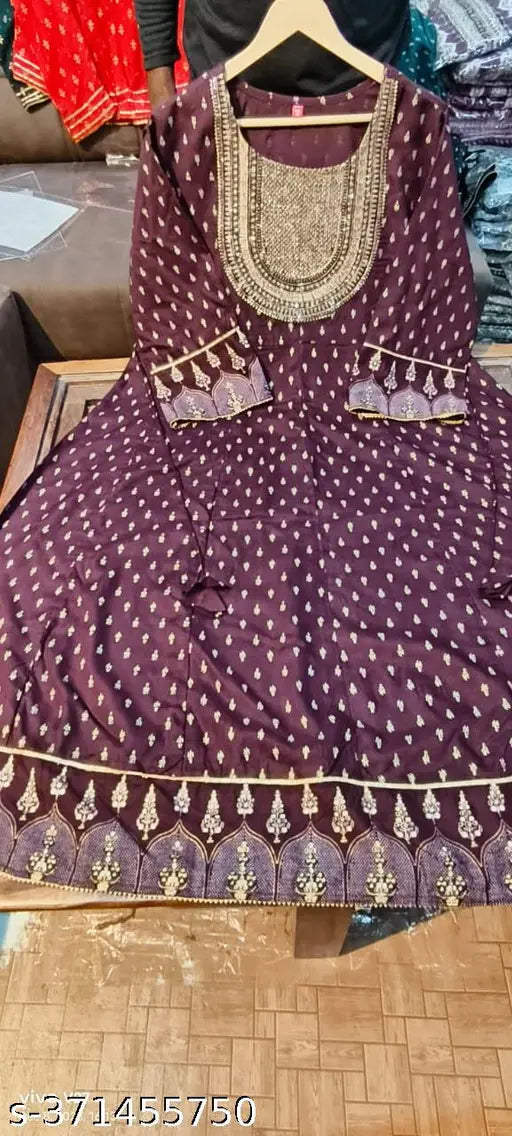 Gold Foil printed Maroon Anarkali kurti with rayon fabric and three-quarter sleeves, featuring intricate patterns on display