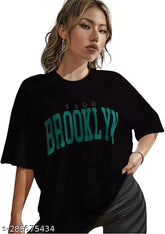 Black cotton blend oversize t-shirt (Brooklyn style), loose fit with off-shoulder design for women, three-quarter sleeves, printed net pattern. Size: S (38 in bust, 26 in length)