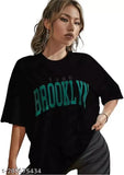 Black cotton blend oversize t-shirt (Brooklyn style), loose fit with off-shoulder design for women, three-quarter sleeves, printed net pattern. Size: S (38 in bust, 26 in length)
