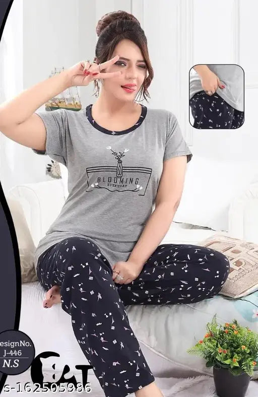 Grey cotton women's sleepwear set: Half sleeve t-shirt & pajama pants with printed design, offering comfort & style for a peaceful night in India