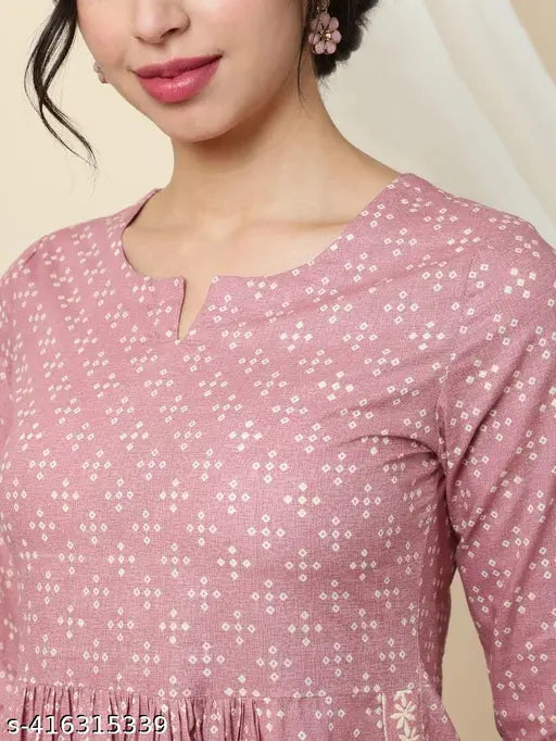 Viscose rayon printed ethnic motifs pleated A-Line pink kurta with palazzos for women, round neck, 3/4 sleeves. Made in India." (120 characters)