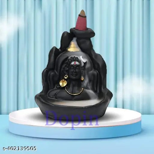 Handcrafted Shiv Shankara, Adiyogi & Yellow Ganesh Backflow Incense Combo with 50 free cones. Decorative religious figurines on display