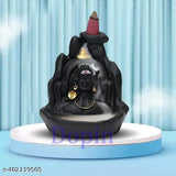 Handcrafted Shiv Shankara, Adiyogi & Yellow Ganesh Backflow Incense Combo with 50 free cones. Decorative religious figurines on display