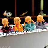 Handcrafted set of 4 miniature laughing Buddha figurines in porcelain, ideal for home decor or car dashboards. Made in India