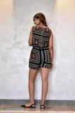 Short black rayon jumpsuit with printed net pattern, sleeveless and available in various sizes from XS to XXL. On a model for visual context