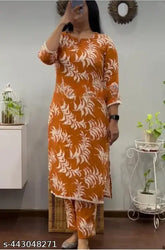 Orange rayon coord set: printed net kurta with palazzos and matching top, three-quarter sleeves on display