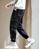High-quality black Lycra cargos for men - trendy workwear trackpants with self design pattern and soft feel, perfect for sporty looks. Sizes available: 28, 30, 32, 34 (Waist: 28/30/32/34, Hip: 38/40/42/44, Length: 39/41in). Made in India
