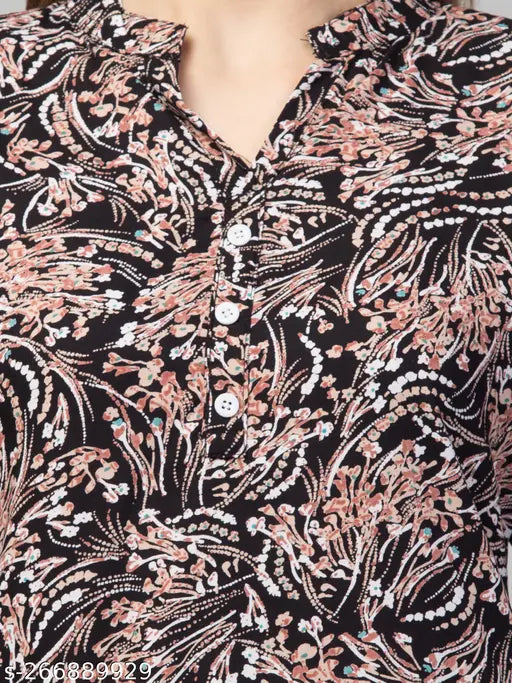Black multi-printed rayon top set with palazzo for women, featuring three-quarter sleeves and intricate woman's dress design. Soft, lightweight, machine washable, and suitable for various occasions. Indian origin