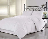 Lightweight cotton blend AC kingsize premium comforter on bed, ideal for cooling sleep