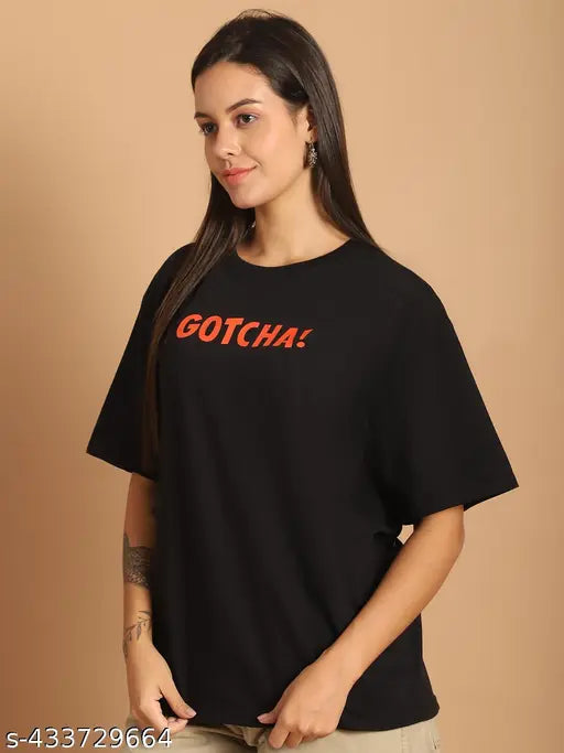 Cotton half sleeve printed oversize black t-shirt for women, vibrant graphics, relaxed fit, loose and versatile