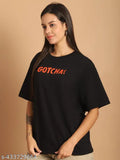 Cotton half sleeve printed oversize black t-shirt for women, vibrant graphics, relaxed fit, loose and versatile