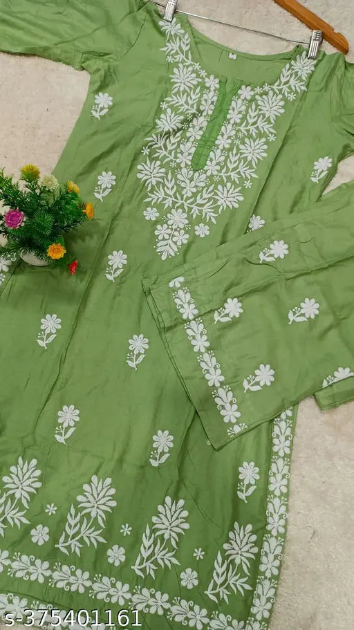 Premium rayon Chikankari embroidered kurta and palazzo set with three-quarter sleeves, single size available. India-made rayon fabric clothing on display